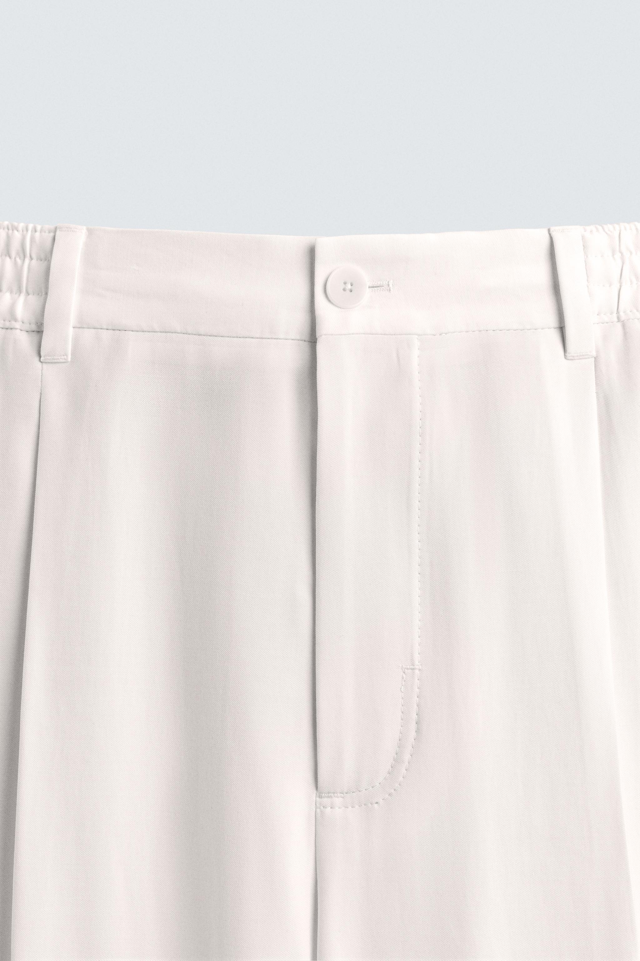 RELAXED FIT PLEATED PANTS