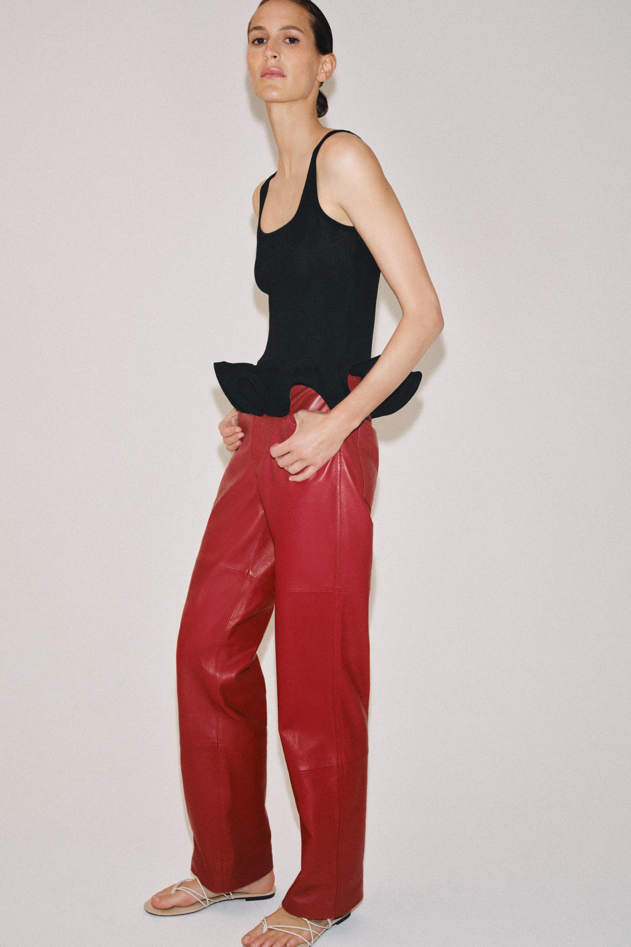 WAVE HEM KNIT TOP — Black