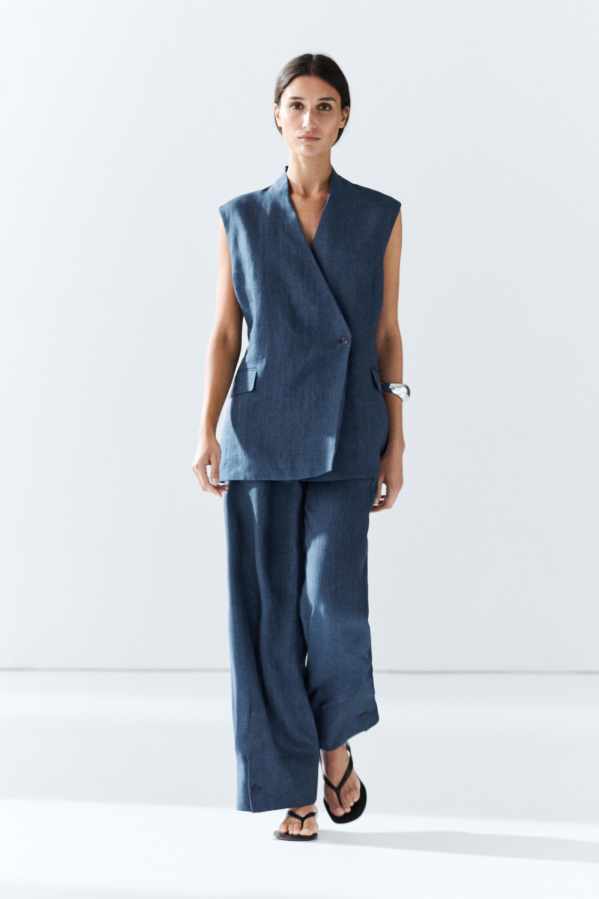 Total look linen pants with buttoned hems