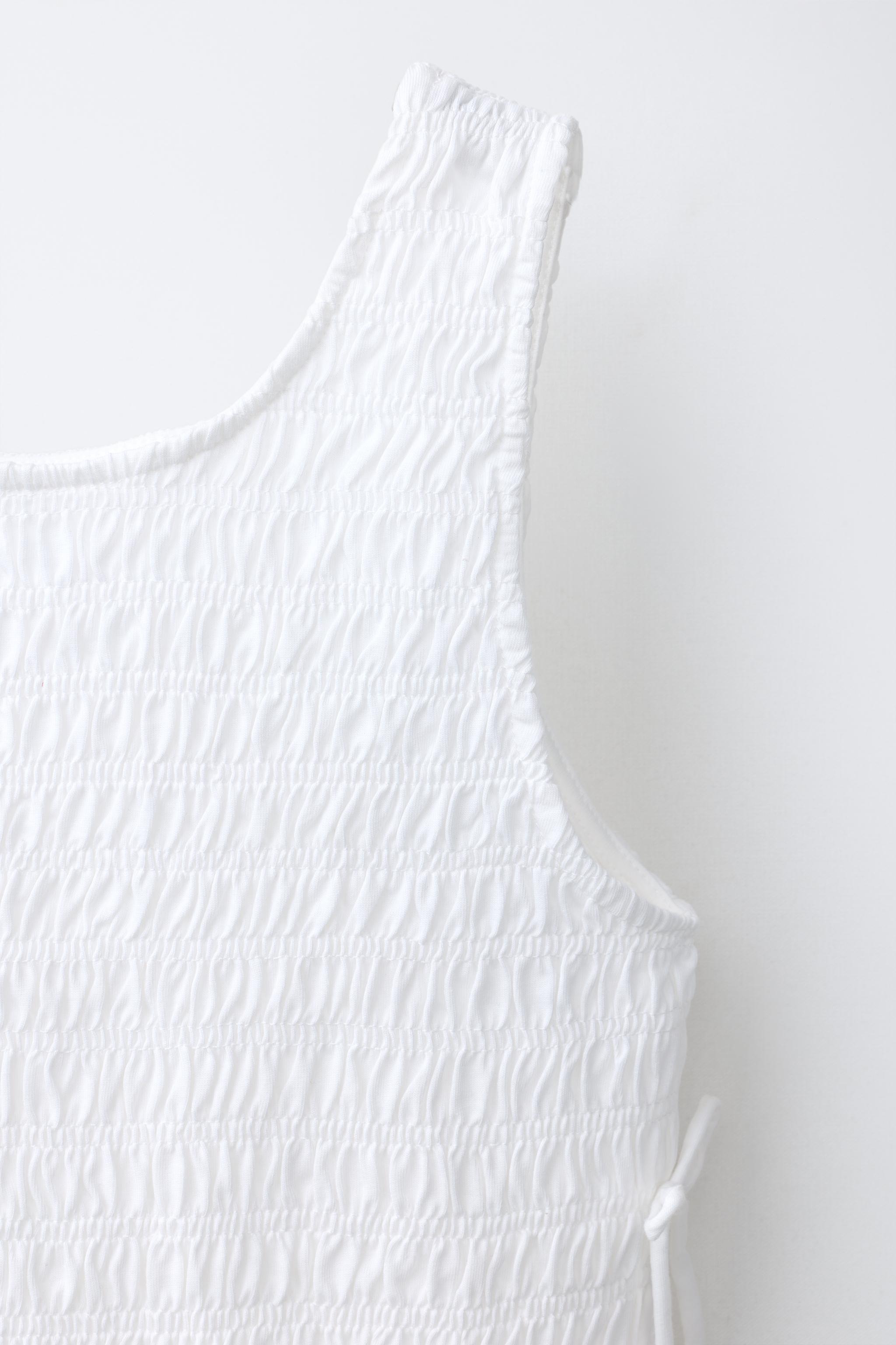 ELASTICIZED TIE TOP