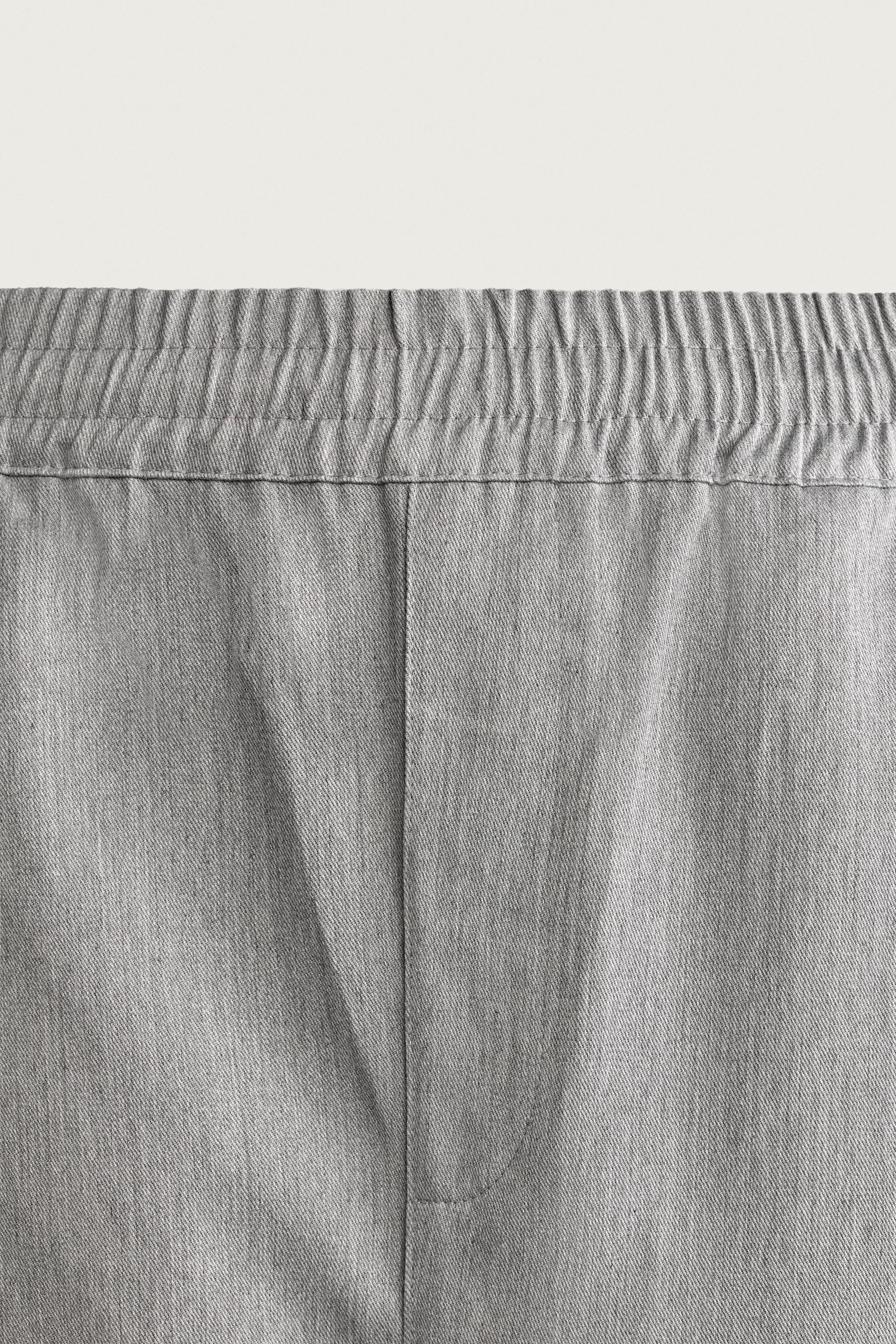 PANTALON BALLOON FIT À PLIS LATÉRAUX