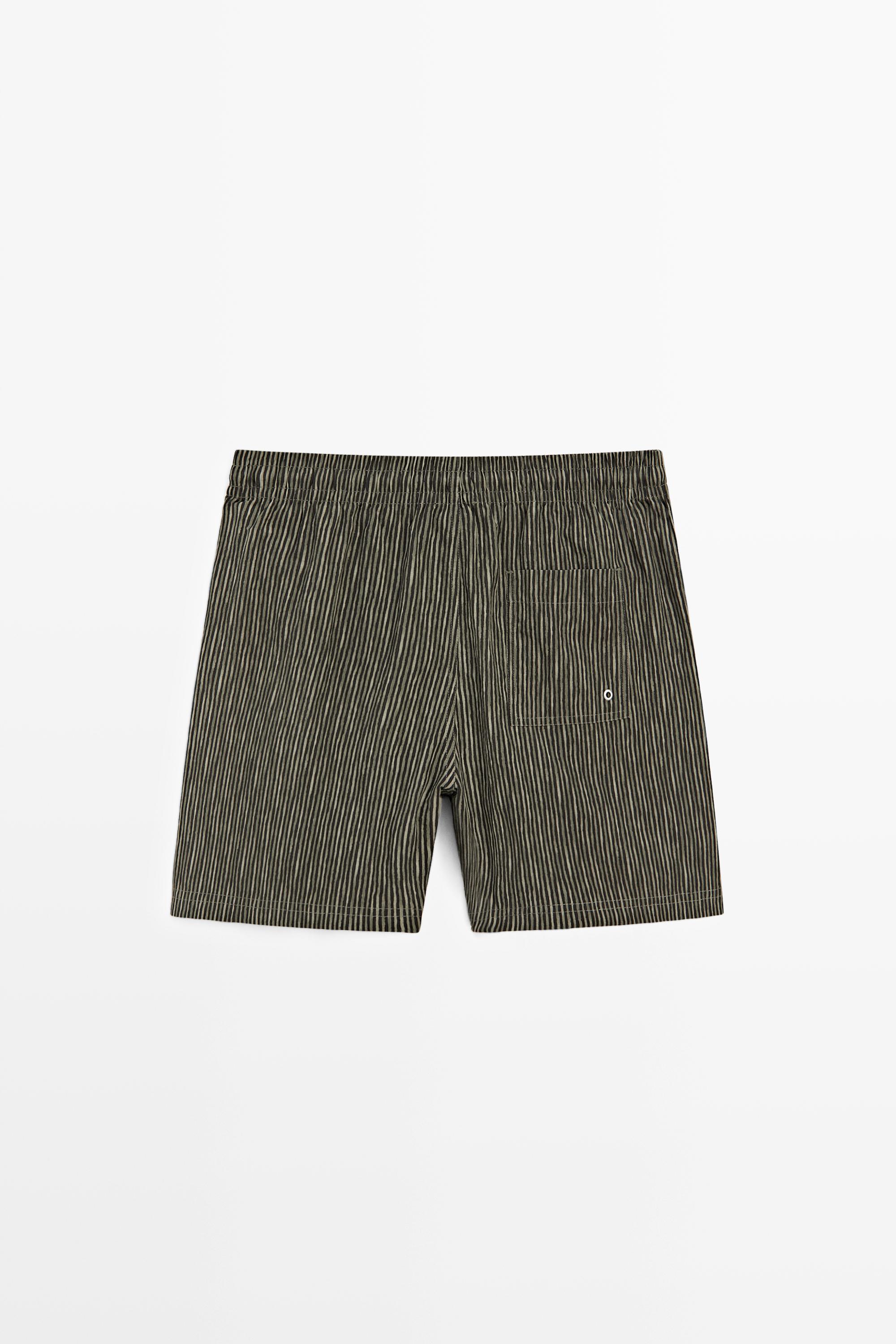 Striped print swimming trunks