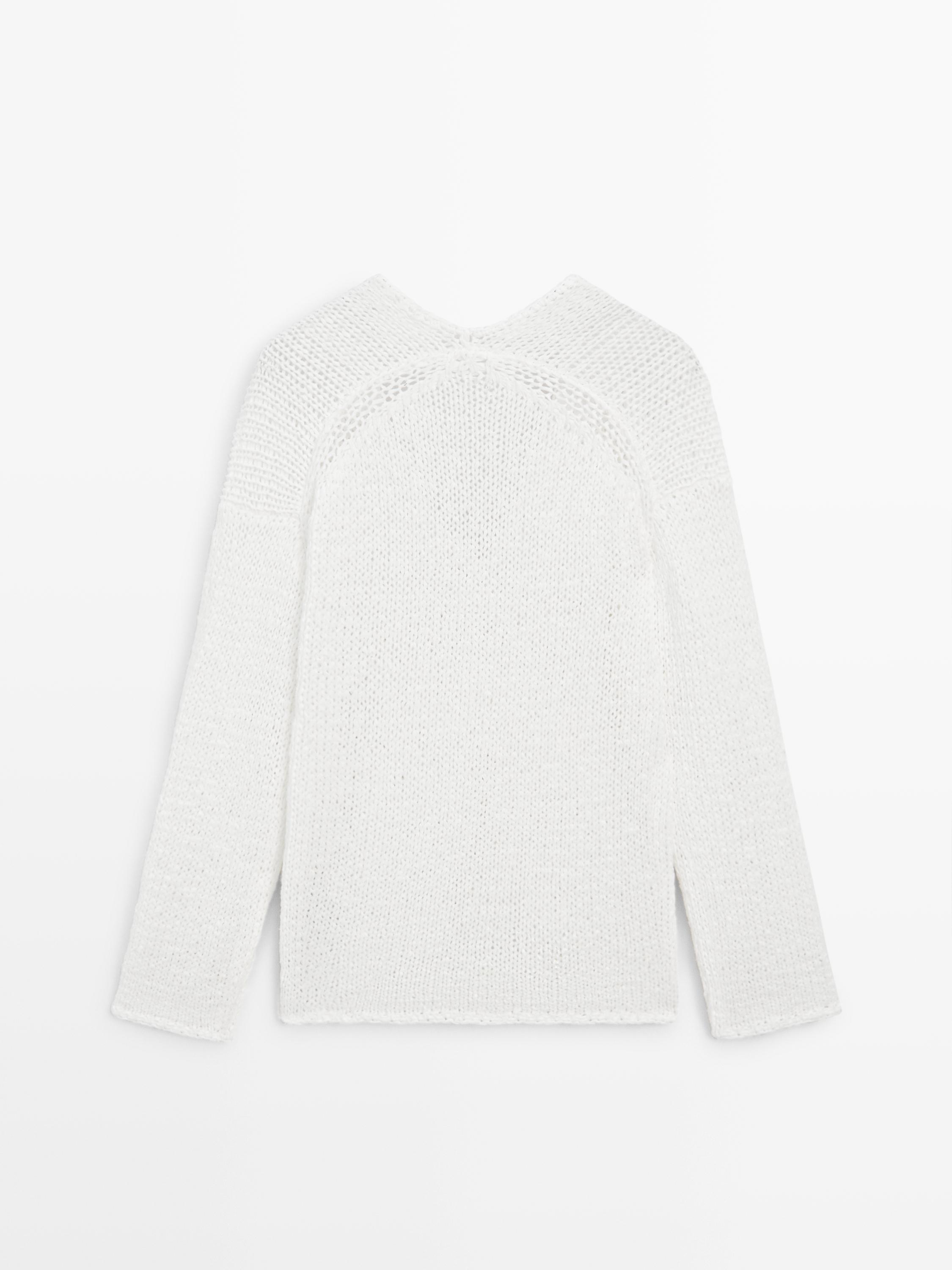 Pull en maille ajourée à col V
