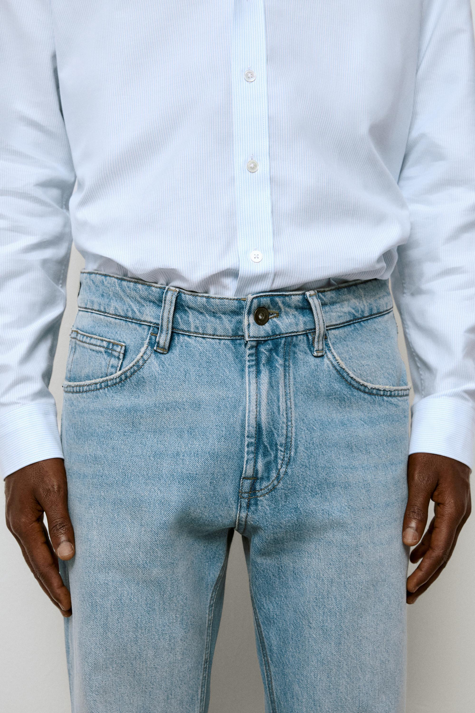 Bleach washed tapered fit jeans
