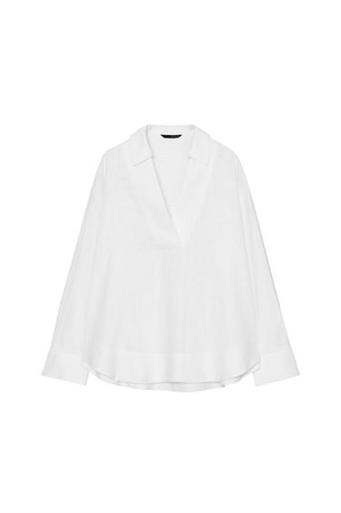 Front view of a white blouse with a polo neck, V-neck, long sleeves, and an asymmetrical hem.