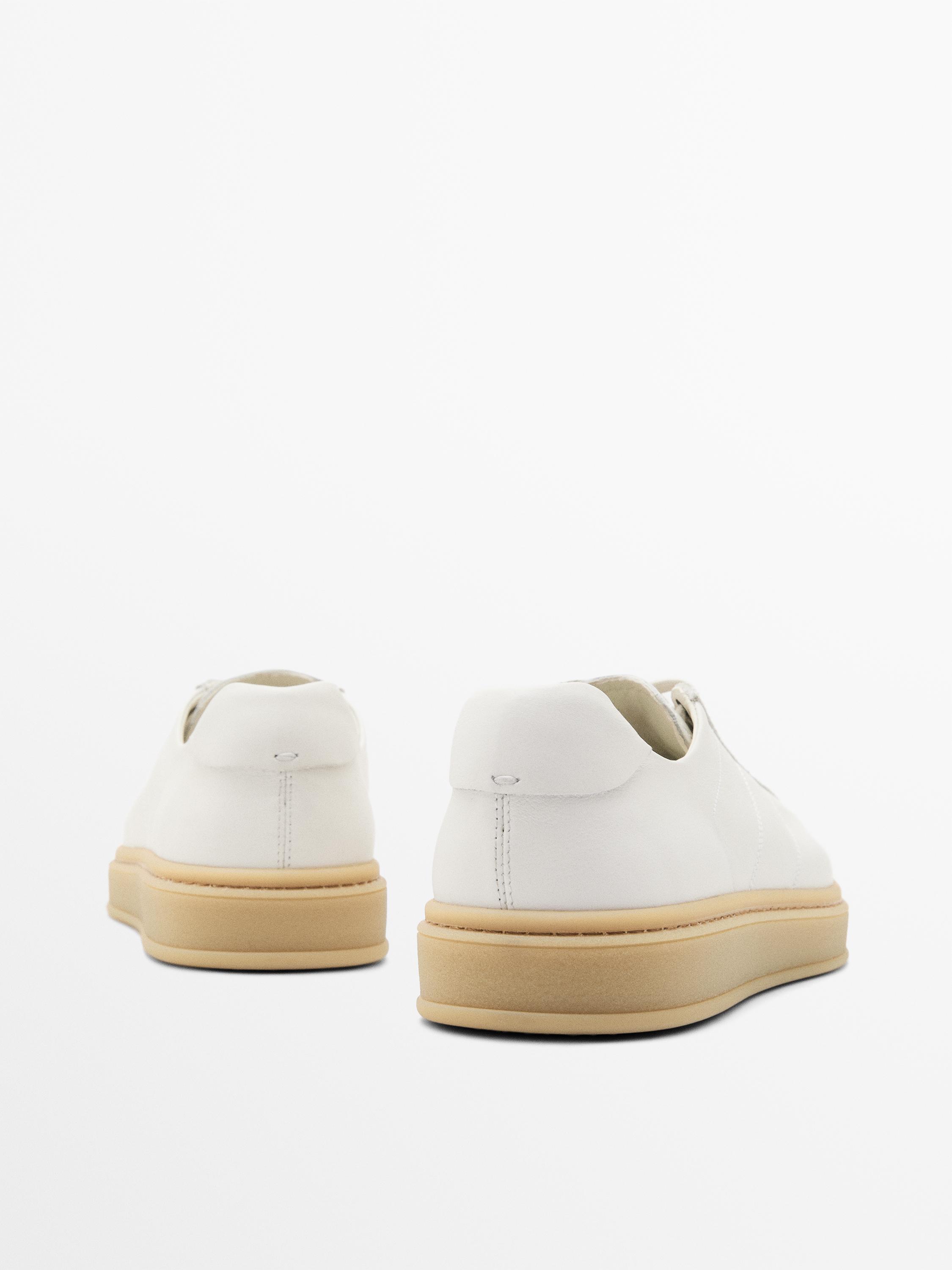 Tennis cuir contrastant