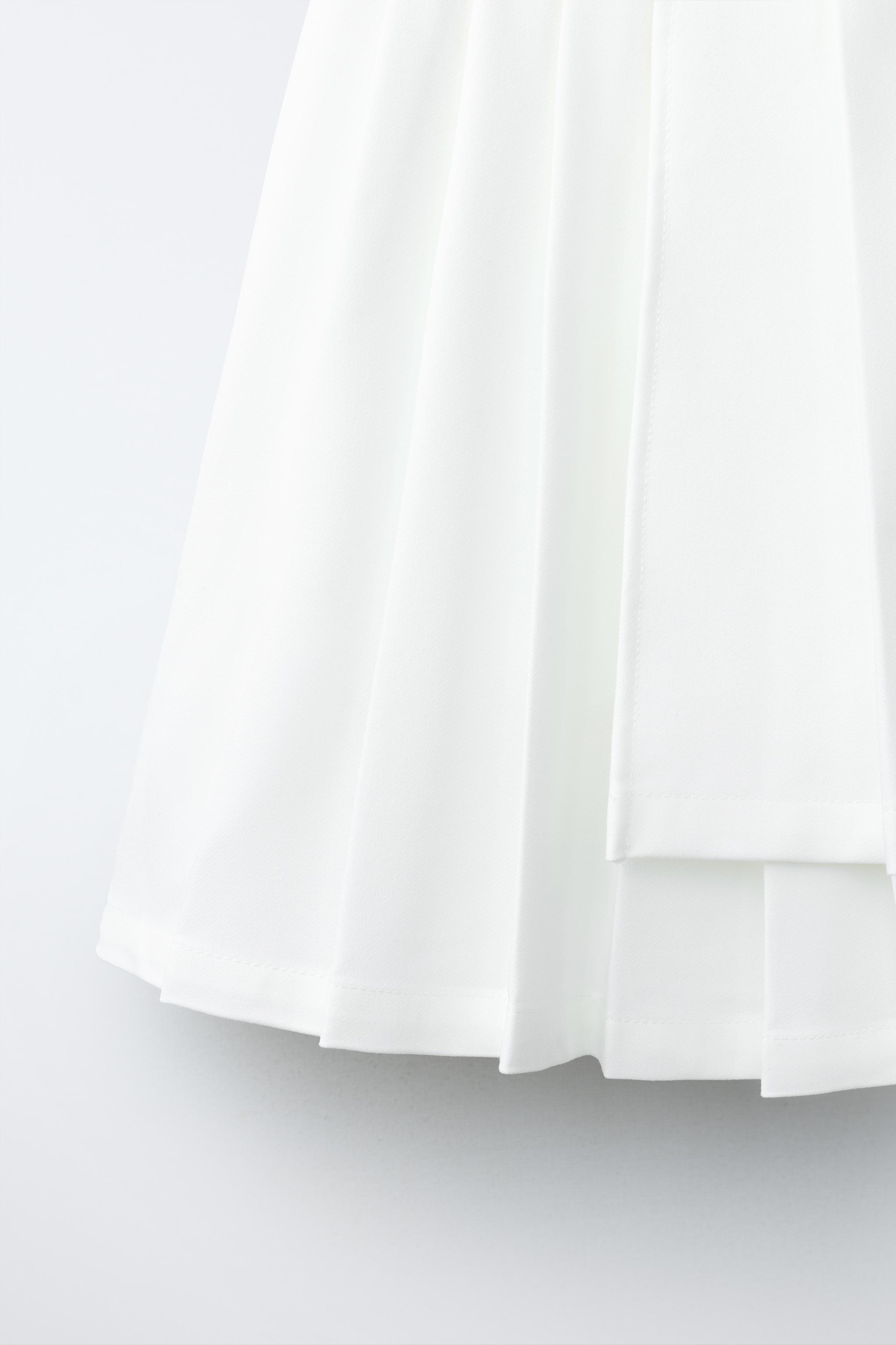PENN © ASYMMETRIC PLEATED SKIRT