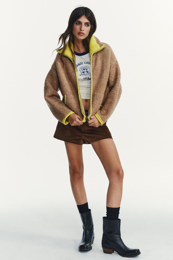 GILET EN MAILLE À FINITIONS CONTRASTANTES