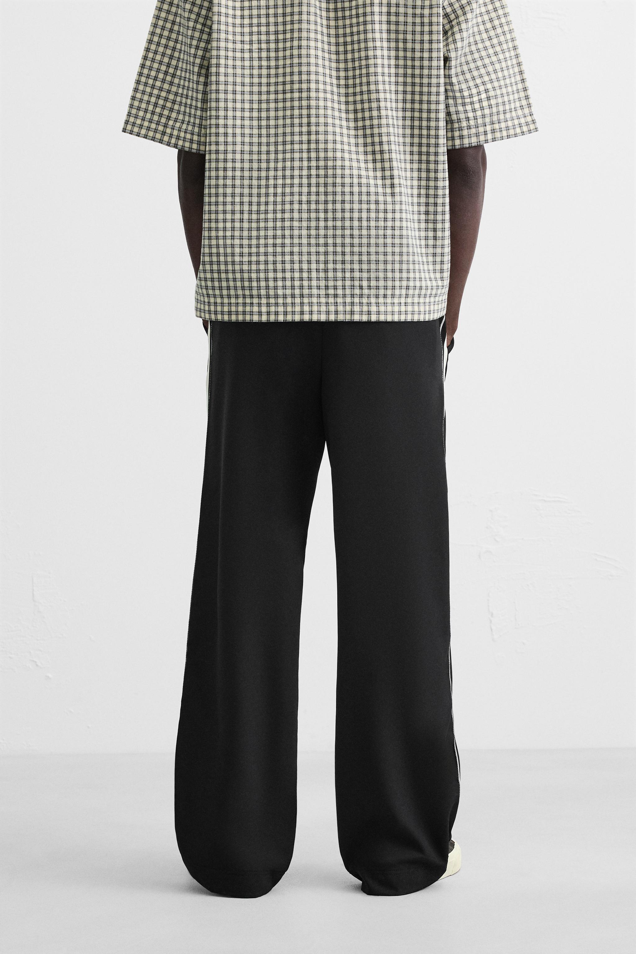 RELAXED FIT PANTS WITH CONTRASTING STRIPES - Black | ZARA