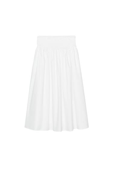 Front view of a white skirt with elasticated waistband and pleats.