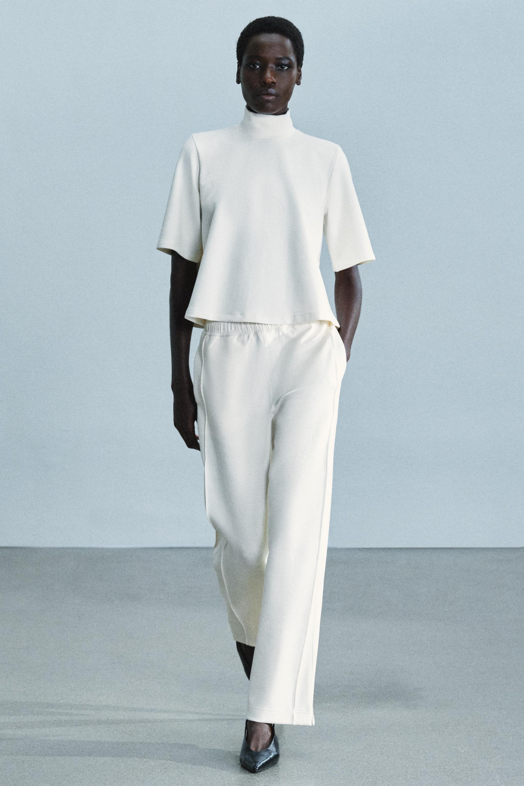 INTERLOCK HIGH-NECK TOP