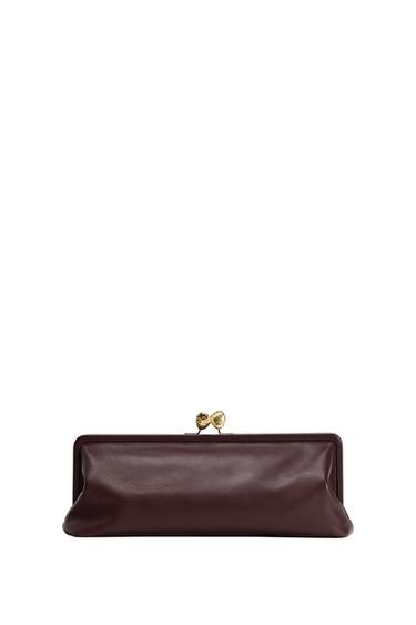Front view of a dark brown clutch bag with gold clasp.