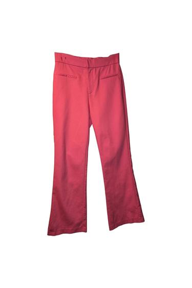 Red straight-cut pants with back pockets, photographed on a white background.