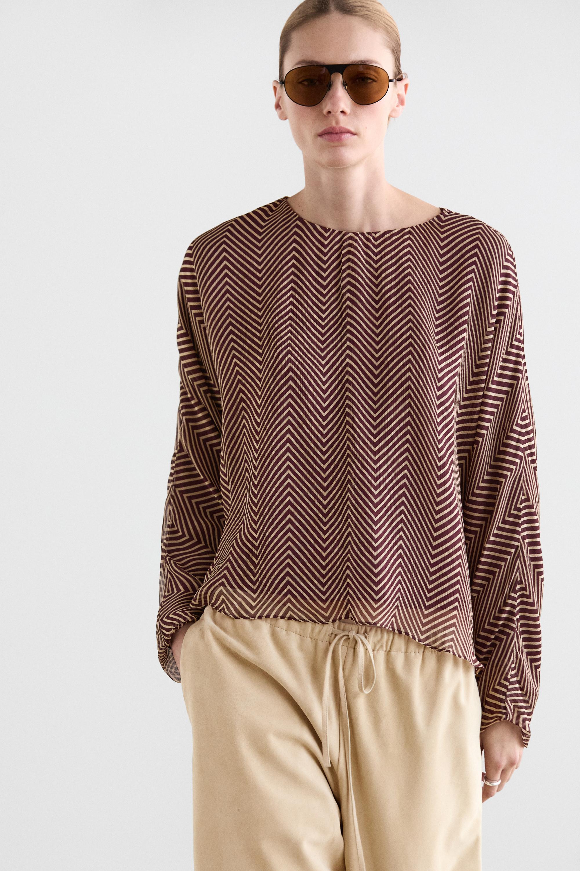 Flowing geometric print blouse