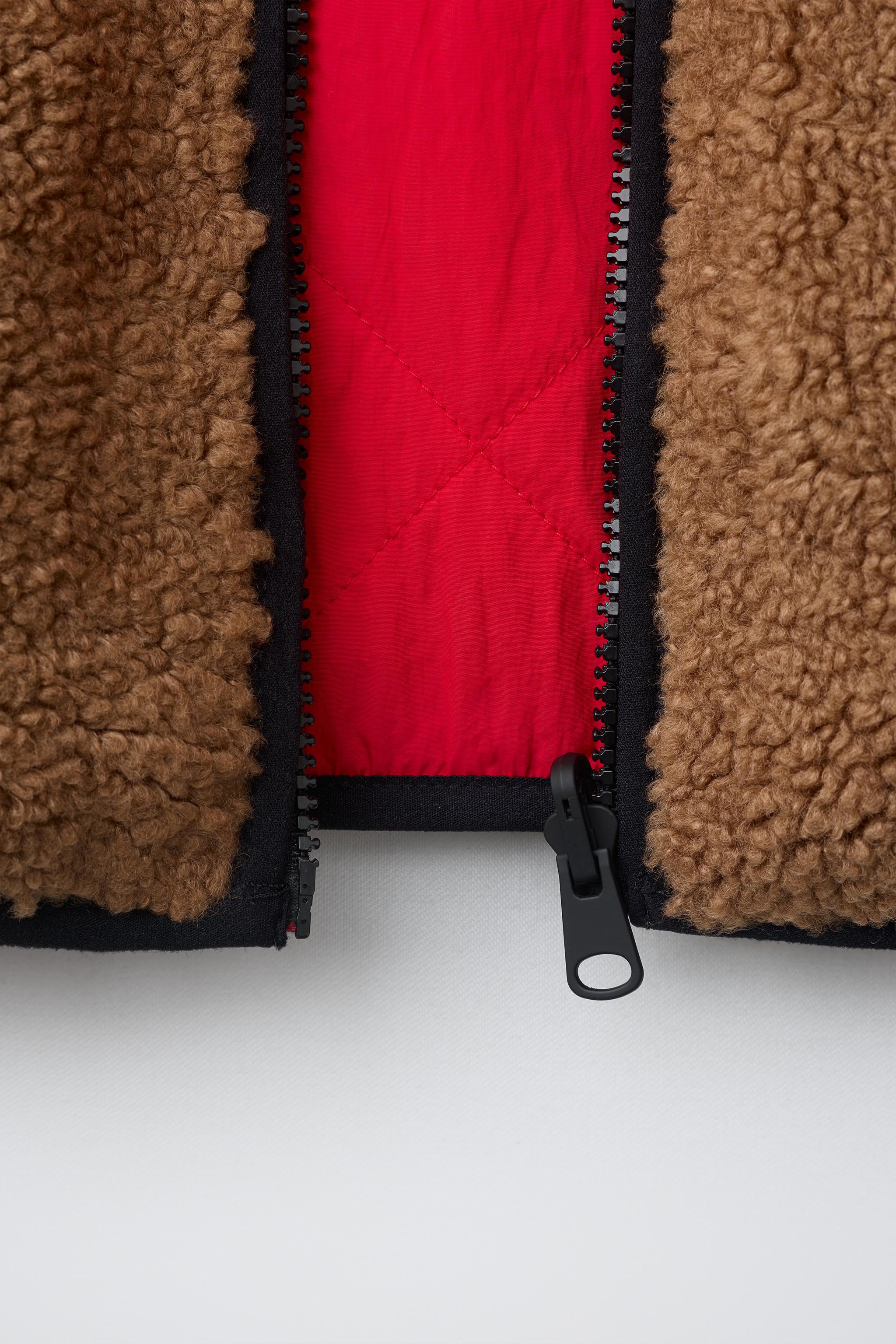 GILET SANS MANCHES RÉVERSIBLE EFFET MOUTON