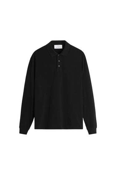 Front view of a black long-sleeved polo shirt with a classic collar and button fastening.