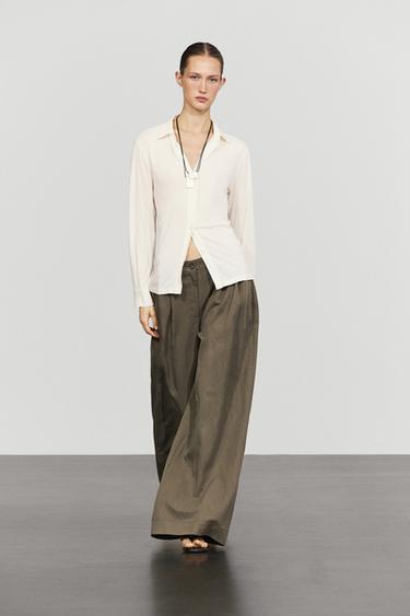 Pantalón fluido pliegues ancho técnico - Negro oro de Zara - Imagen 0