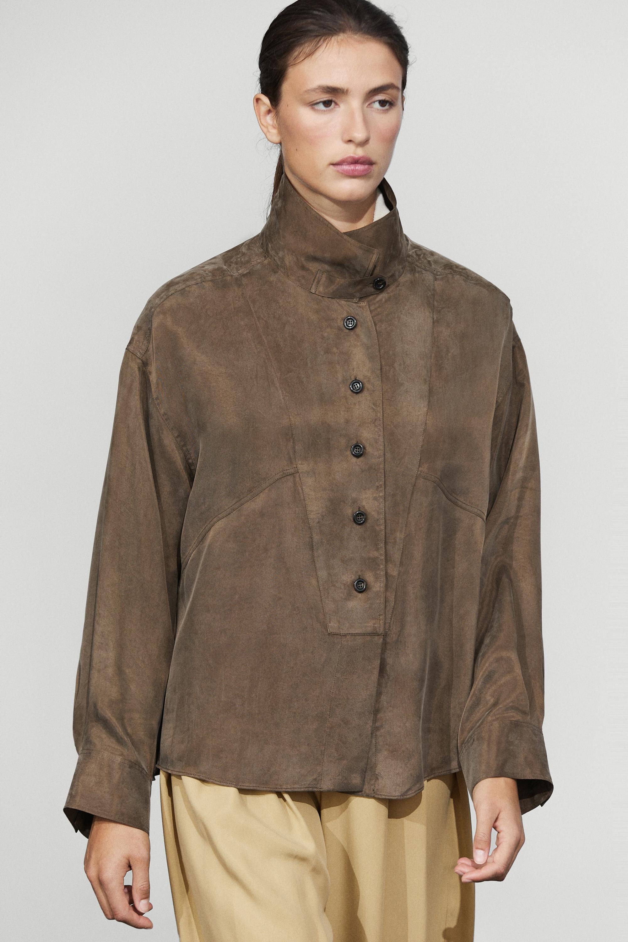 Flowing shirt with stand collar and bib detail