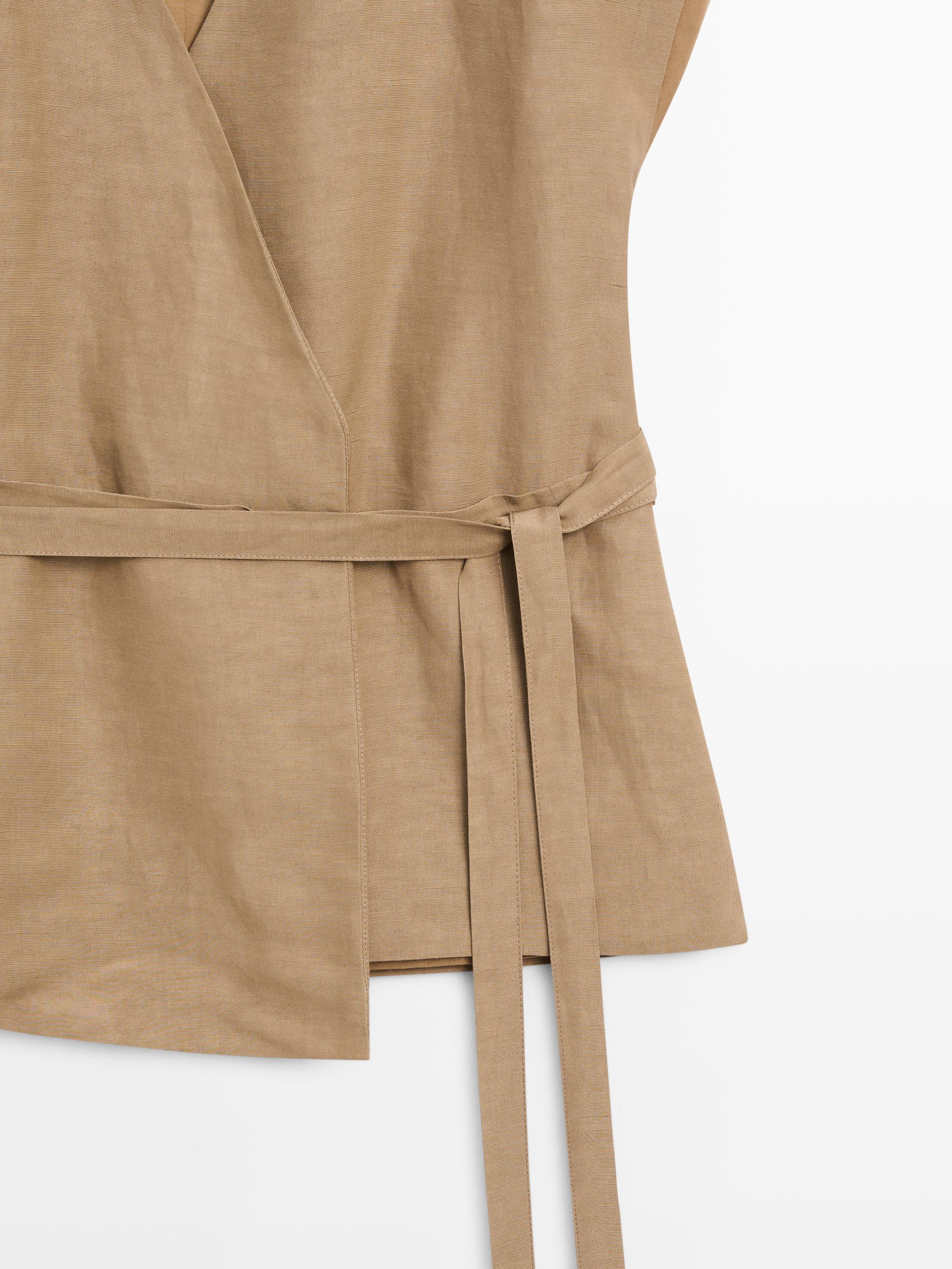 Veste longue cache-cœur sans manches