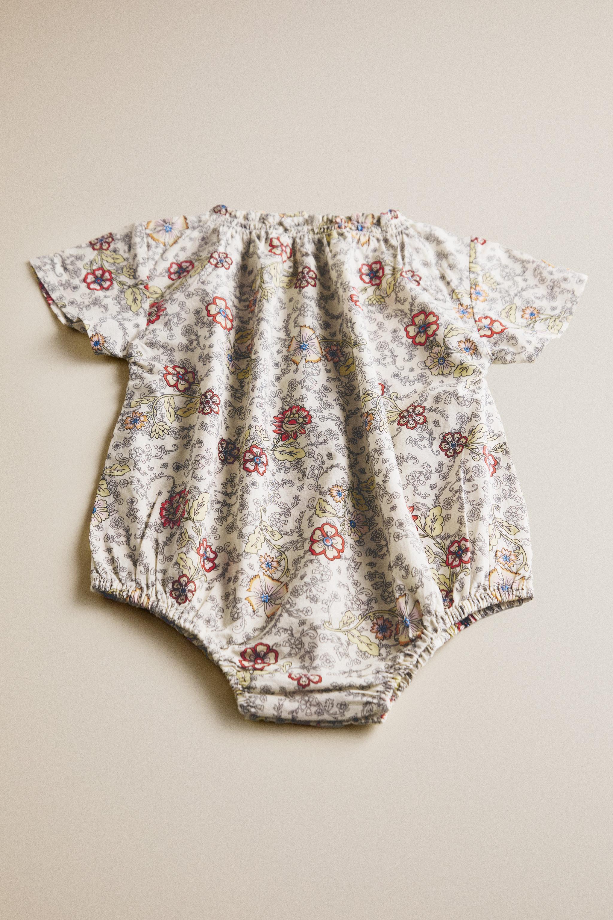 BABY FLORAL FOOTED ROMPER — Light beige