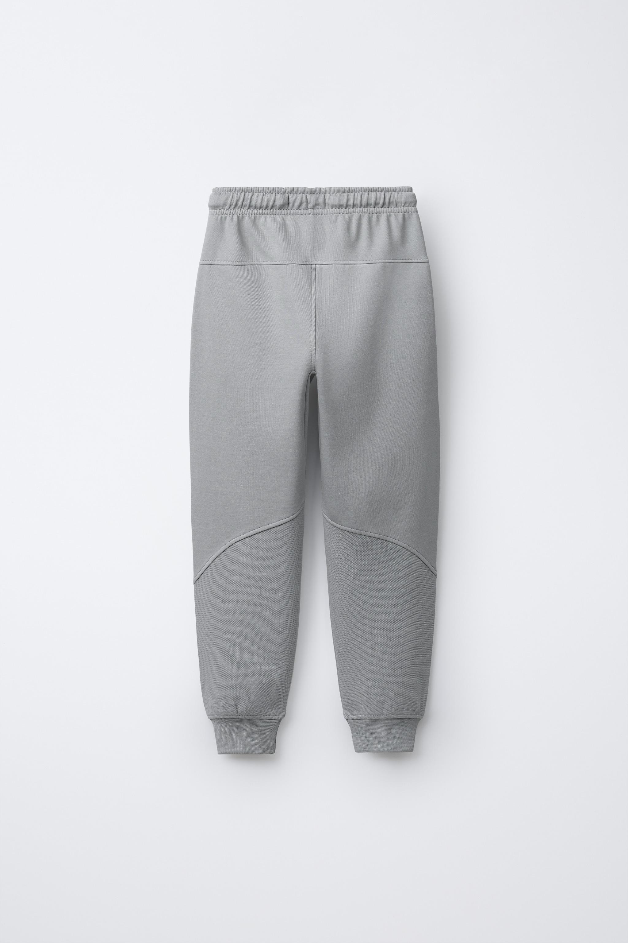 PANTALON EN MOLLETON INTERLOCK ET PIQUÉ