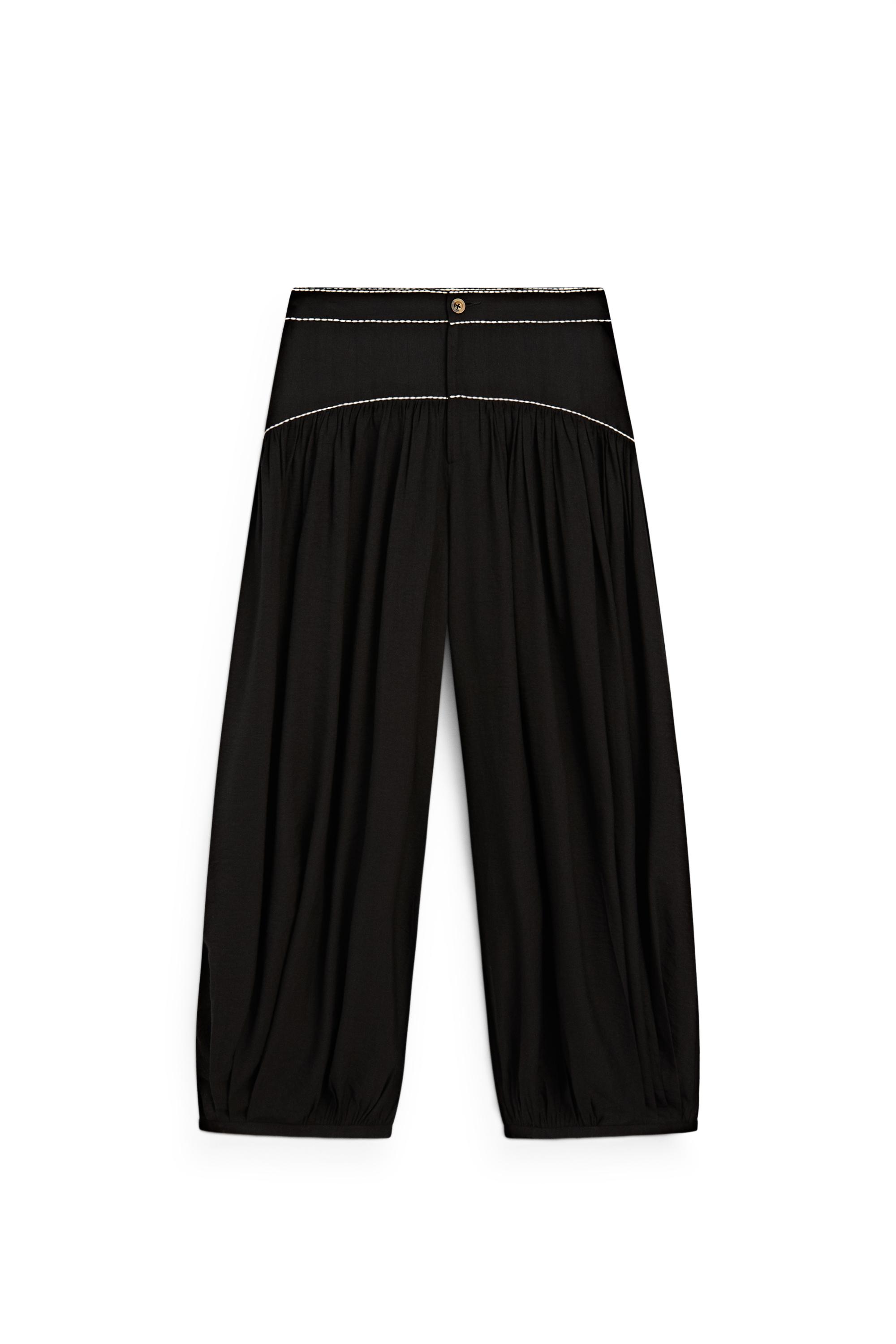 Flowing trousers with contrast detail