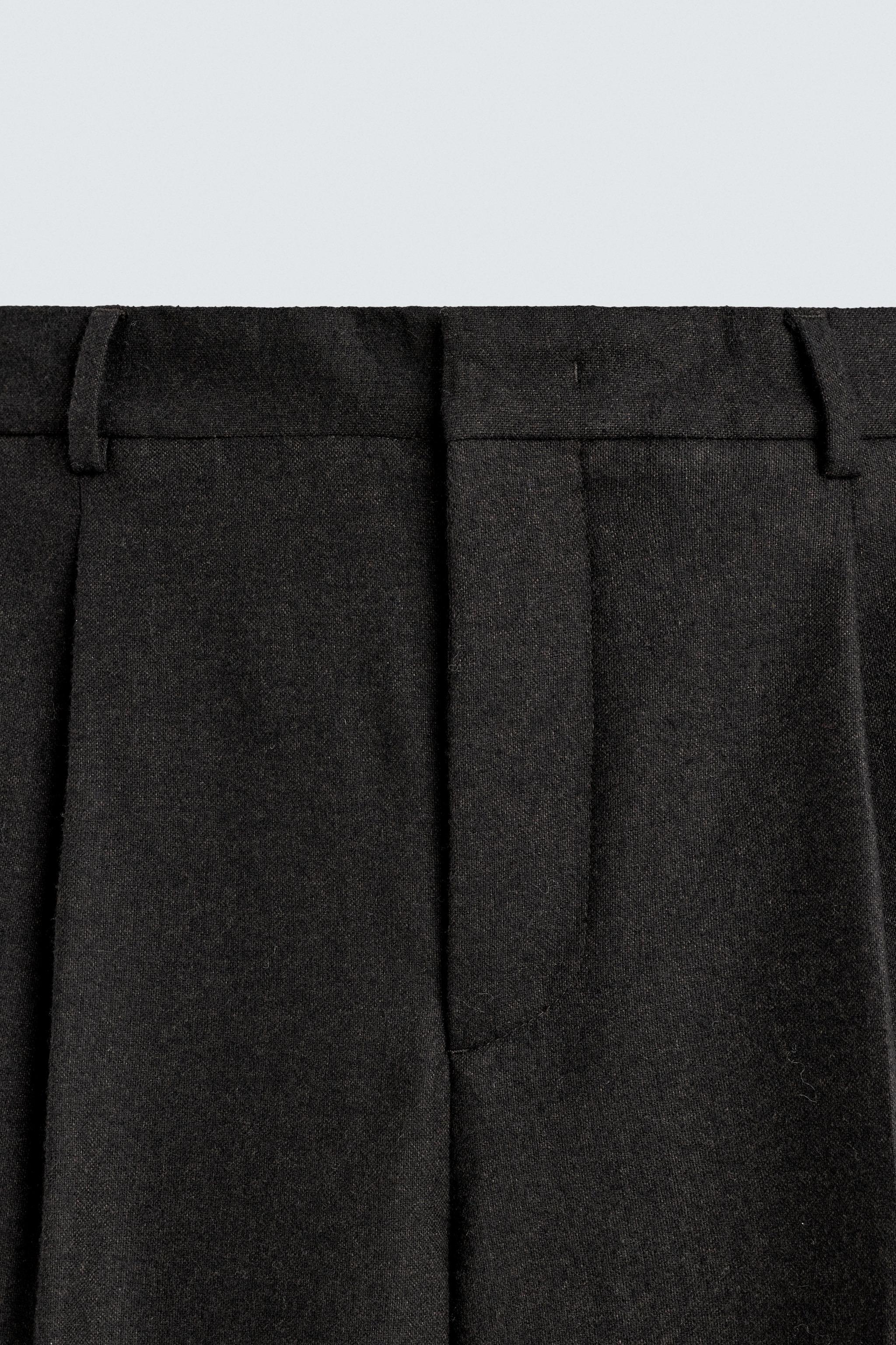 LIMITED EDITION PLEATED WOOL PANTS