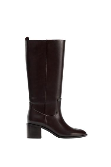 Dark brown high-heeled boot with a chunky heel on a white background.