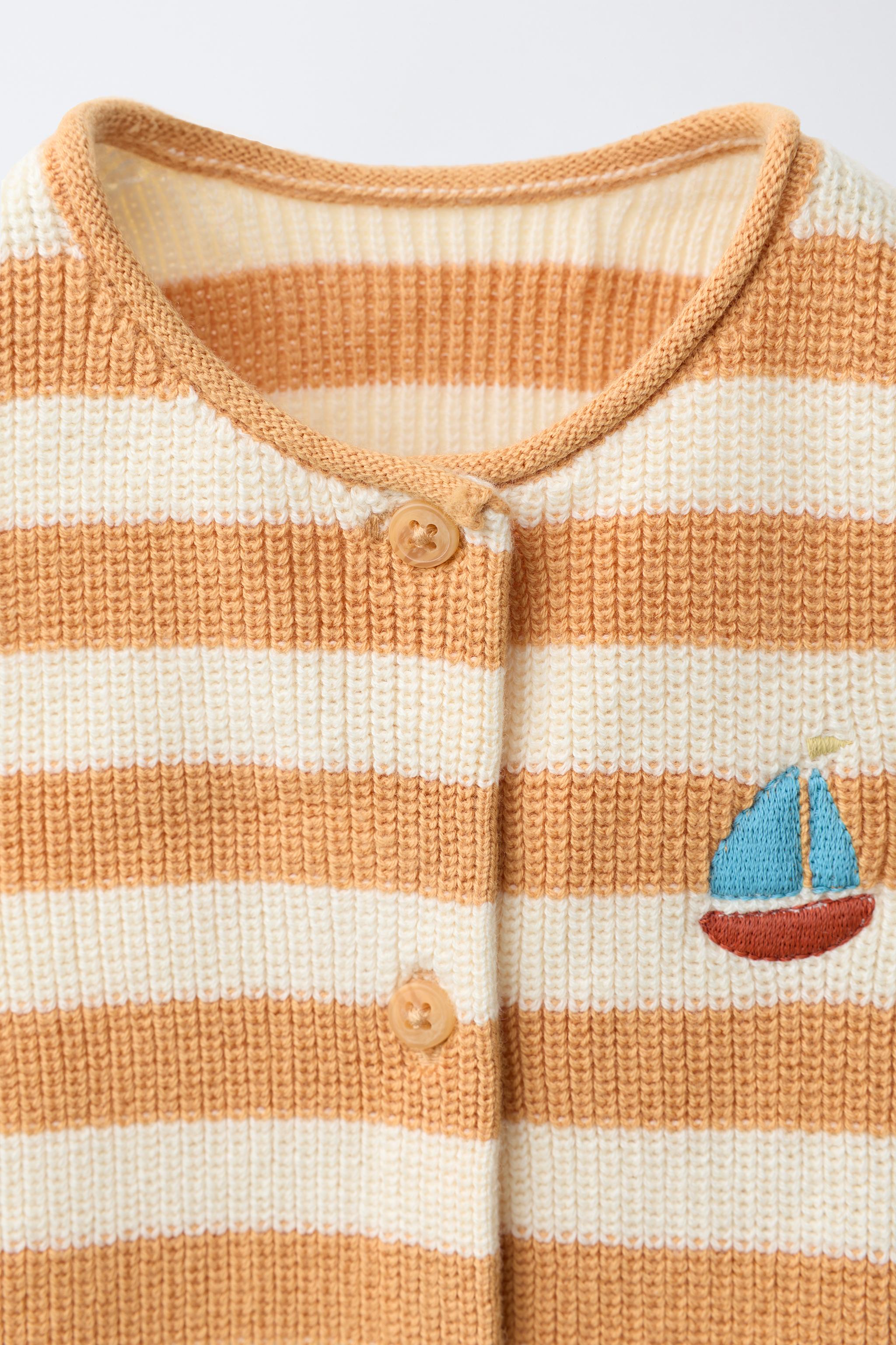 STRIPED KNIT ROMPER WITH EMBROIDERED BOAT