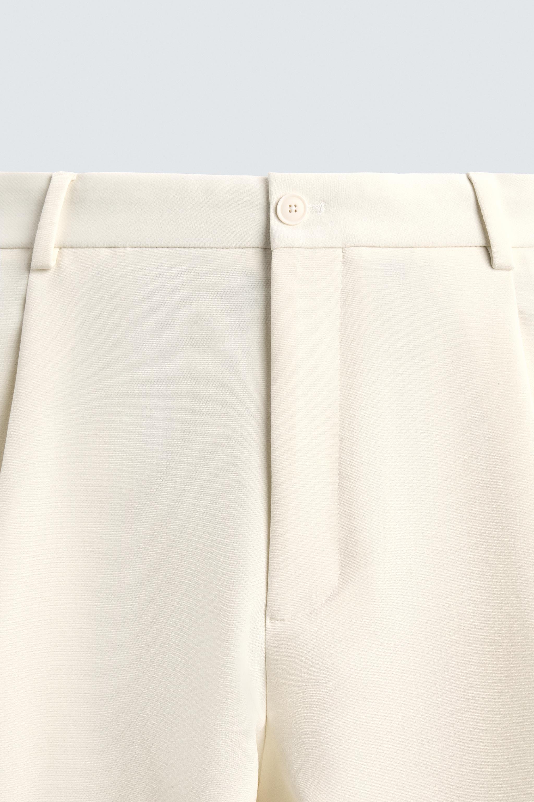 PANTALON RELAXED FIT À PLIS