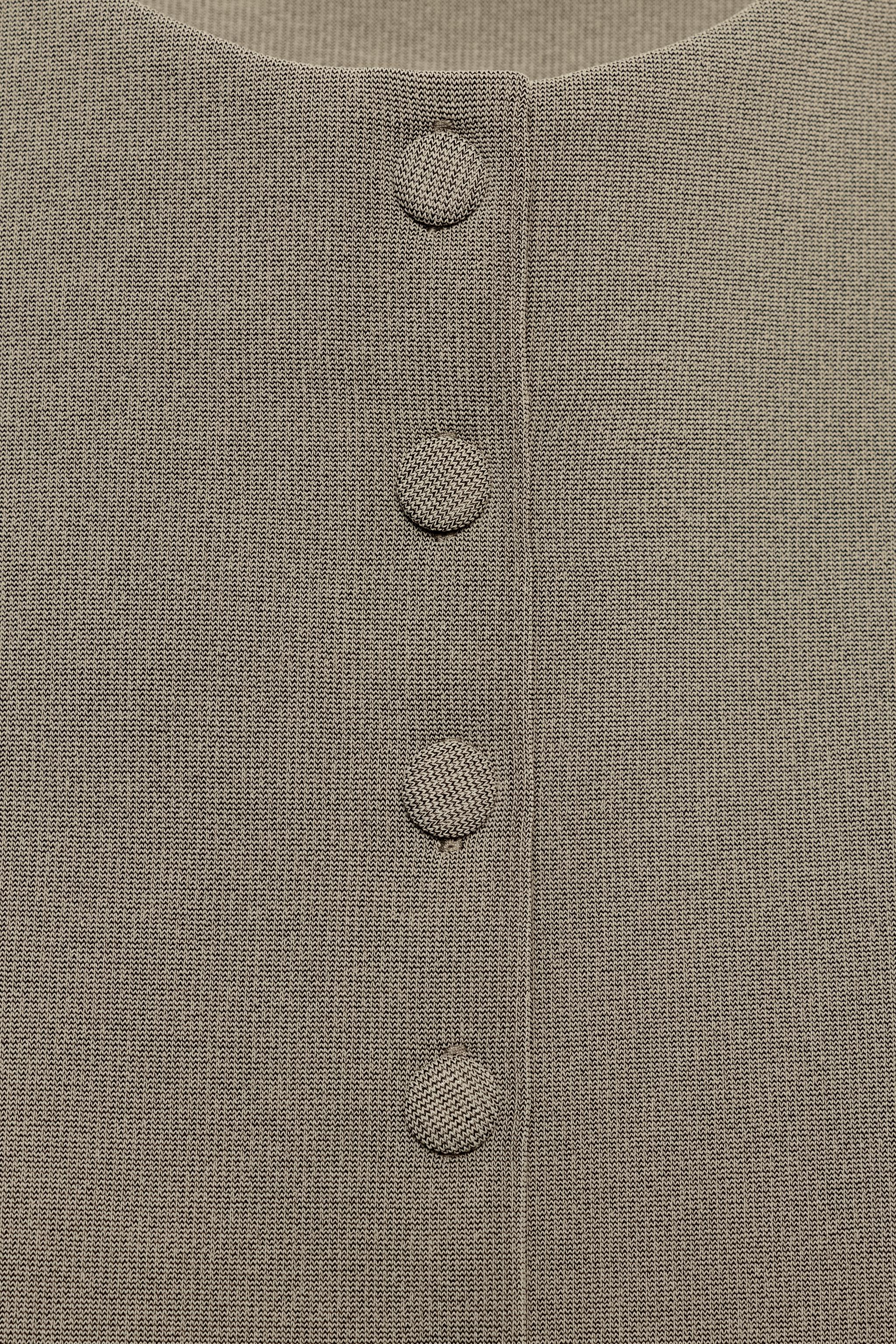 GILET À BOUTONS REVÊTUS