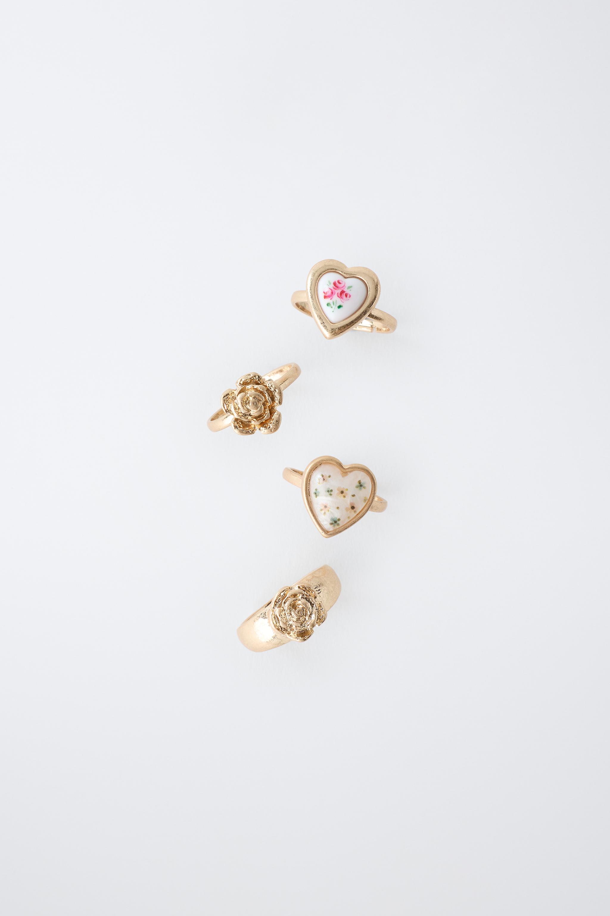 PACK OF FOUR FLOWER AND HEART RINGS — Golden