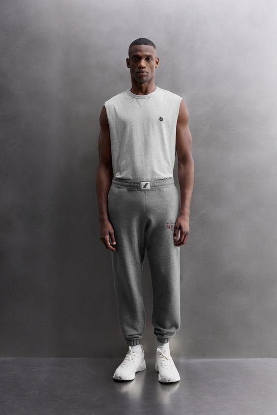 JOGGING PANTS WITH PRINTED TEXT