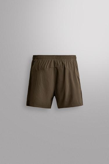 PANTALONS CURTS RUNNING 5" - Verd gris de Zara