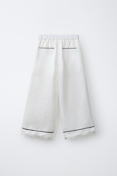 PANTALON À JAMBES LARGES ONDULÉ - Écru de Zara - Image 1