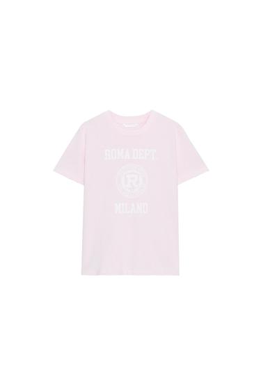 Front view of a pastel pink T-shirt with a crew neck and short sleeves. Text "ROMA DEPT. MILANO" on the front.