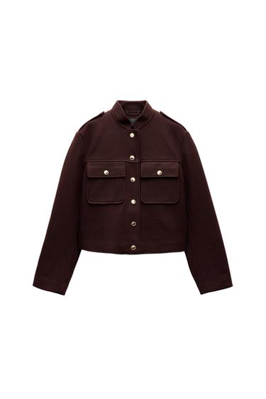 Front view of a brown jacket with gold buttons and flap pockets.