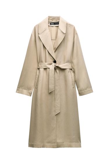 Front view of a beige coat with a belt and wide lapels, side pockets.