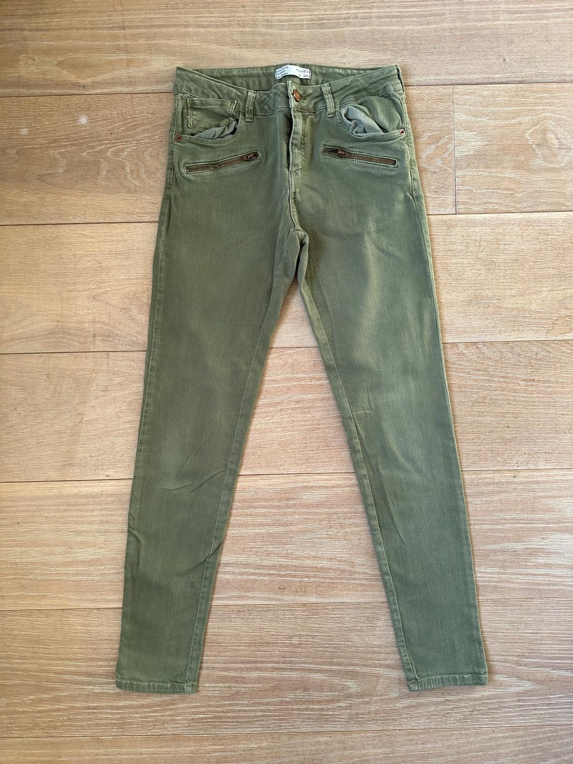 Front view of olive green trousers with zip front pockets.