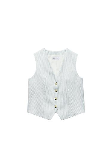 Fine white and grey striped waistcoat with five gold buttons. Visible inner label with text: "ZARA". White background.