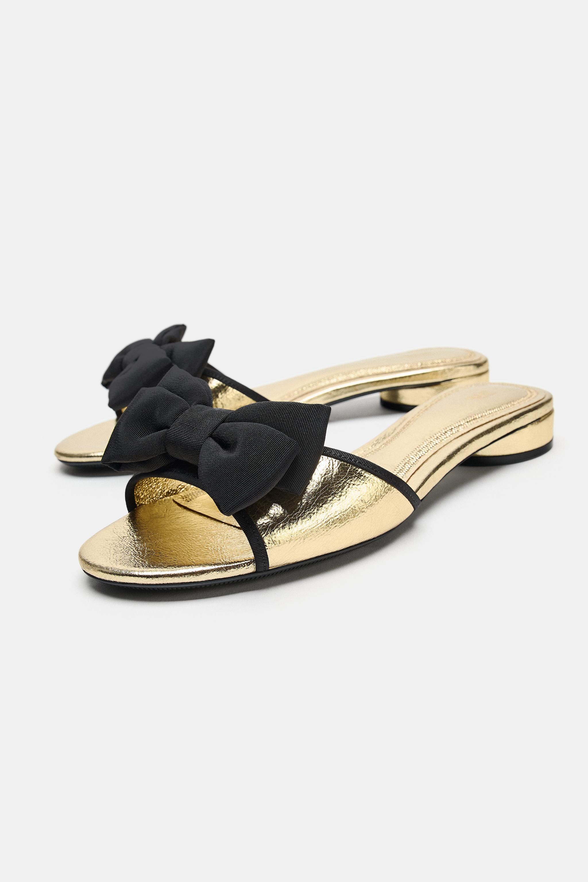 METALLIC FLAT SANDALS WITH BOW DETAIL