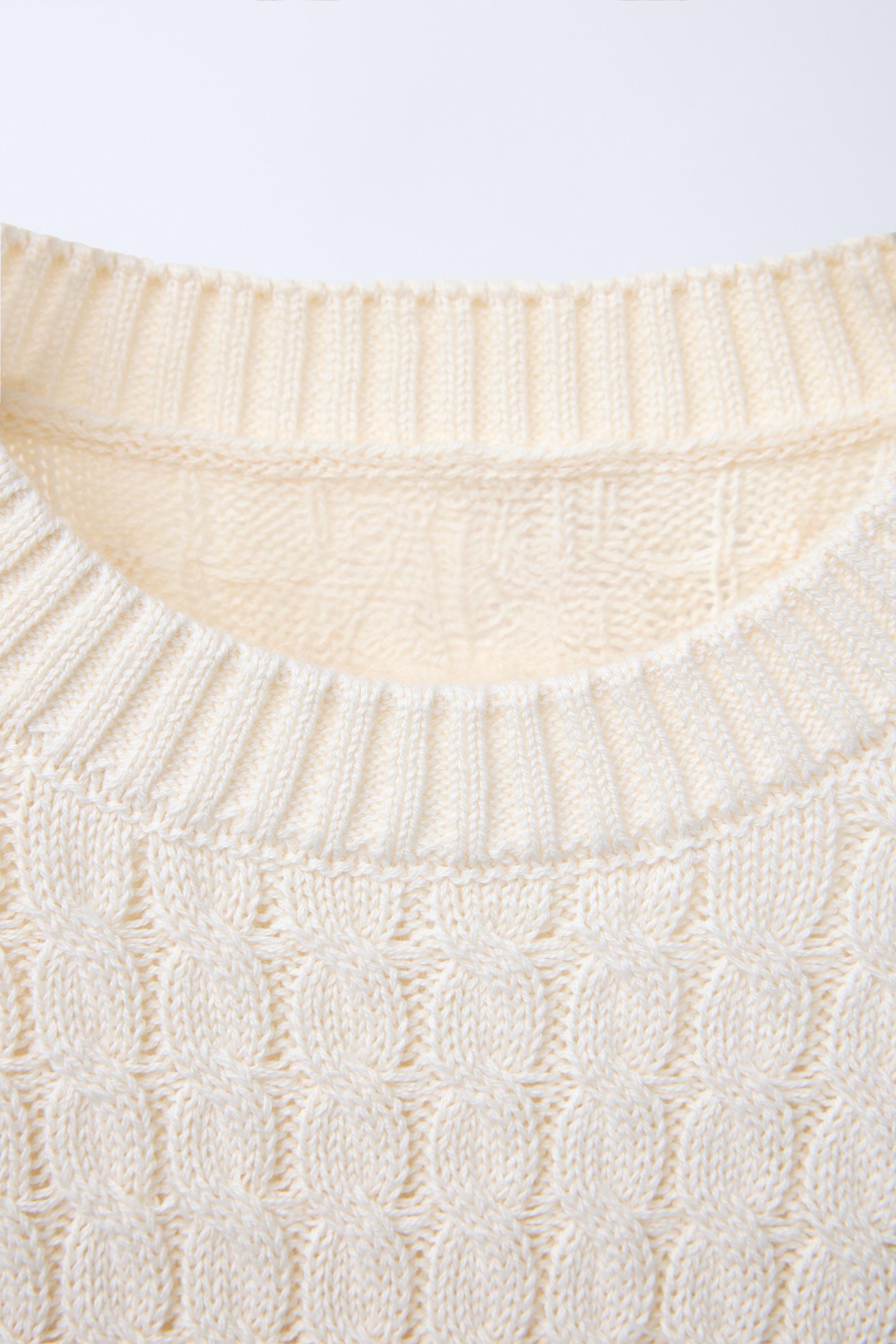 PULL EN MAILLE À TORSADES