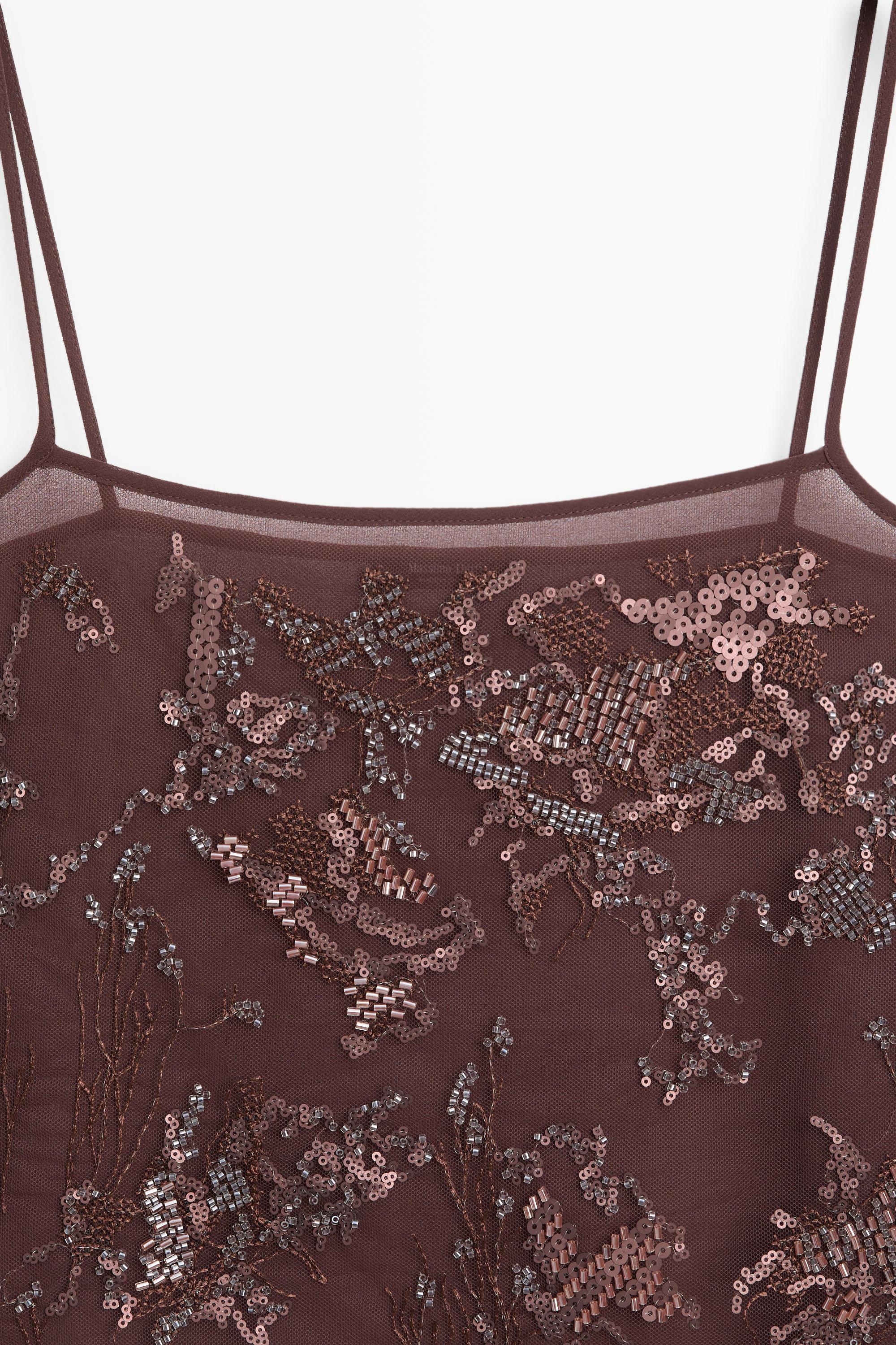 Flowing strappy top with embroidered detail