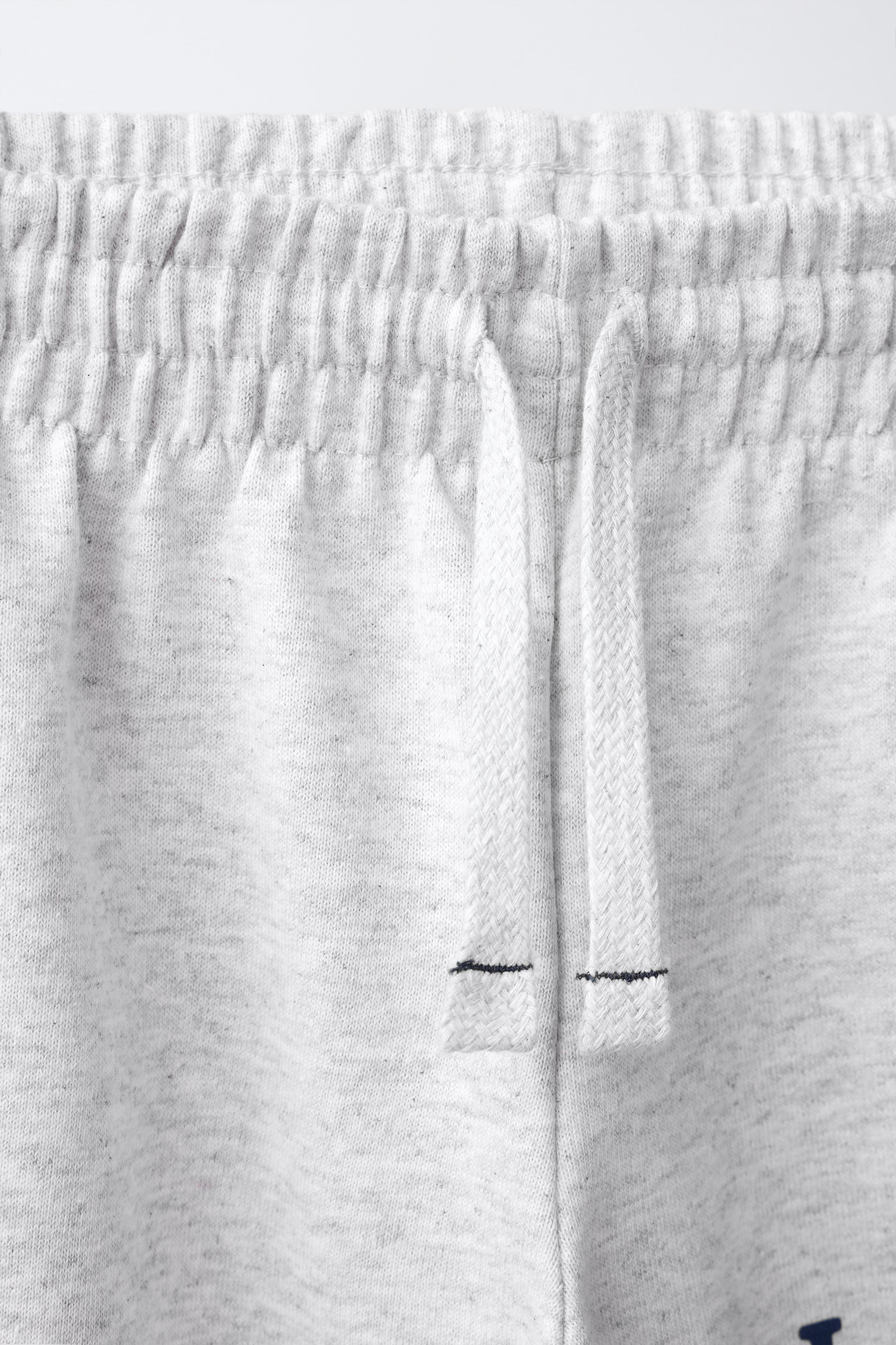 TEXT PRINT WIDE-LEG PANTS