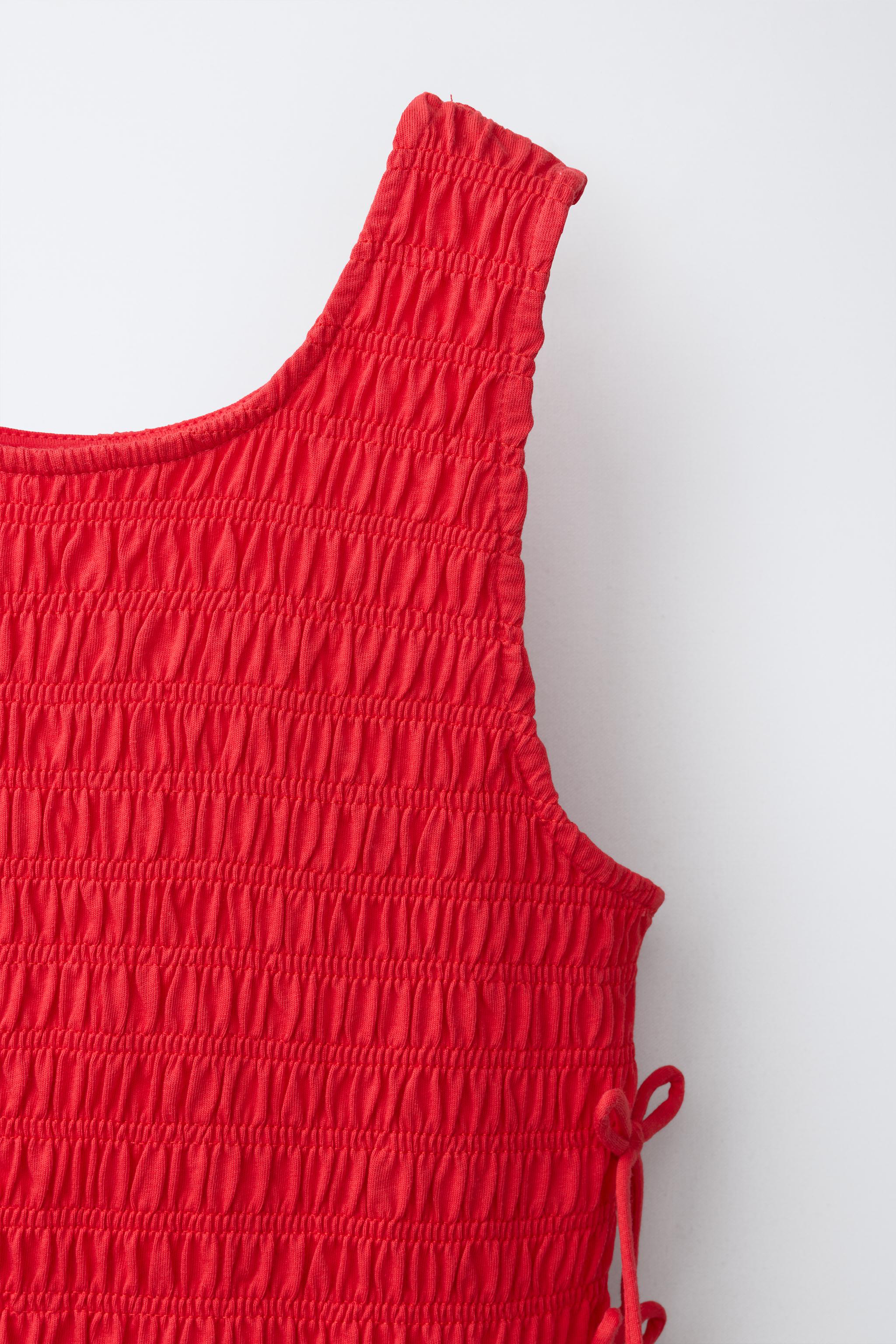ELASTICIZED TIE TOP