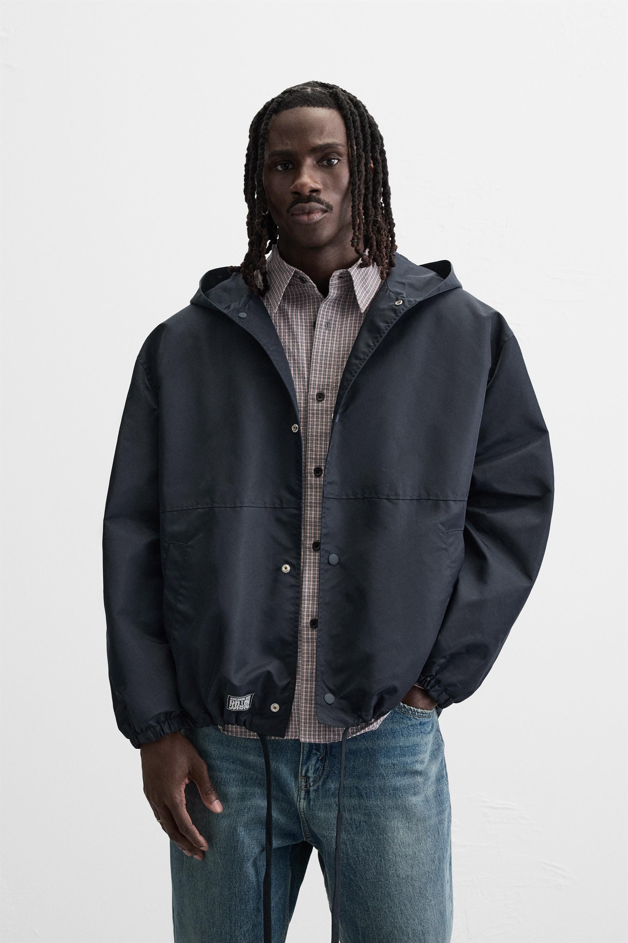 BLOUSON TECHNIQUE À CAPUCHE