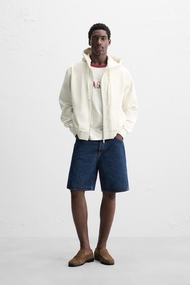 سويت شيرت بسحاب وغطاء رأس بيزك - أبيض مكسور الخاص بـ Zara