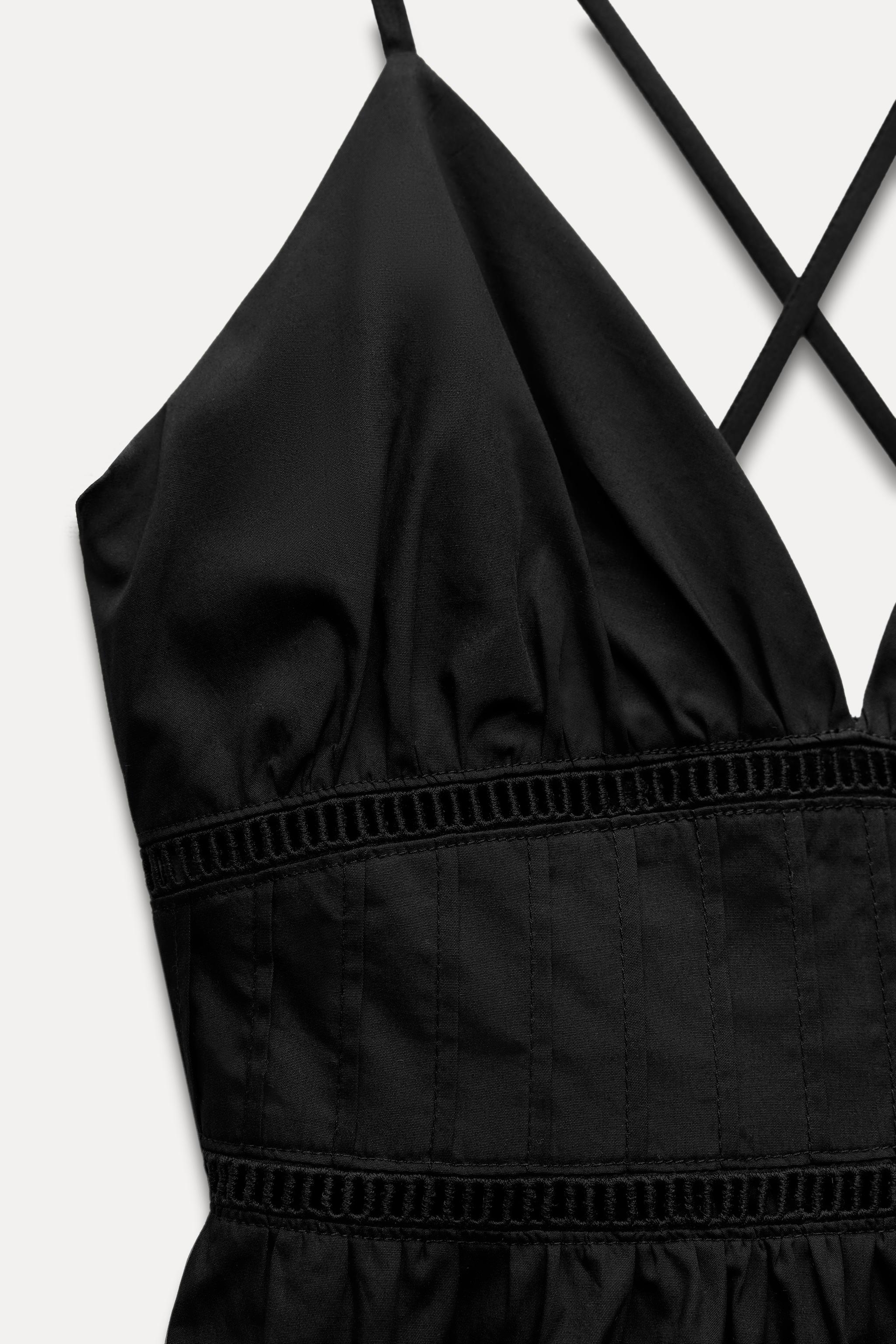 V-neck dress with thin straps that cross at back. Tonal lace V-neck dress with thin straps that cross at back. Tonal lace