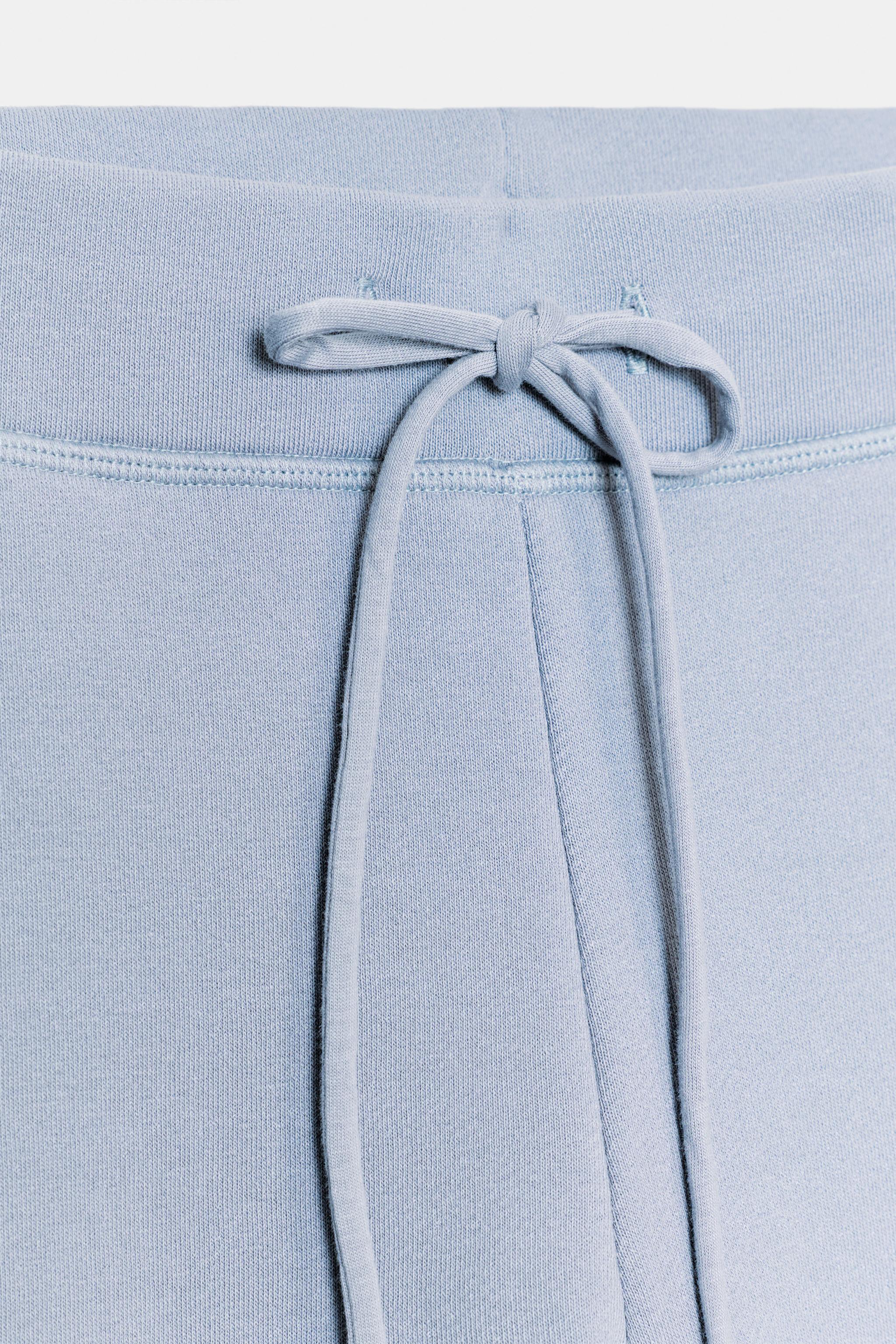 WASHED-EFFECT FLARE TROUSERS