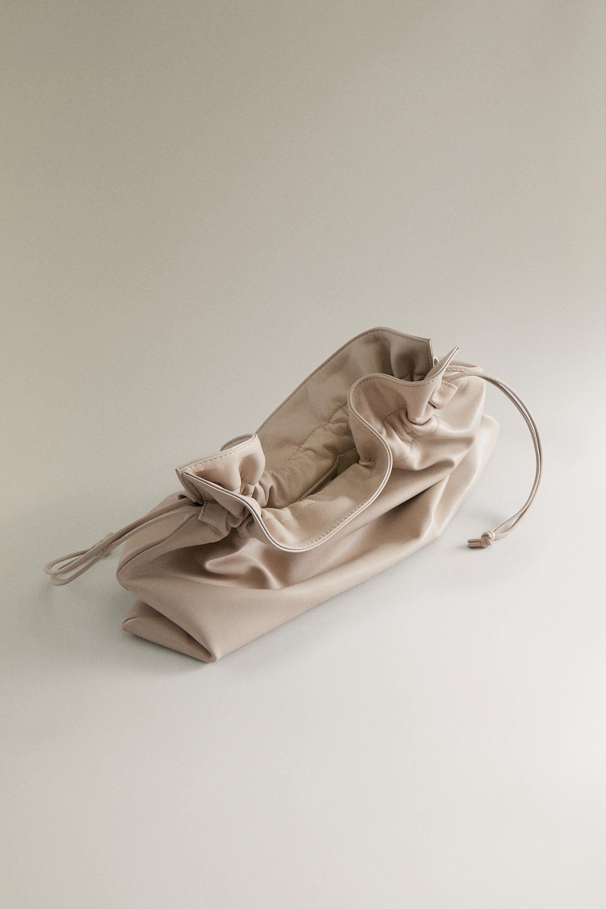GRAND SAC POCHETTE EN CUIR
